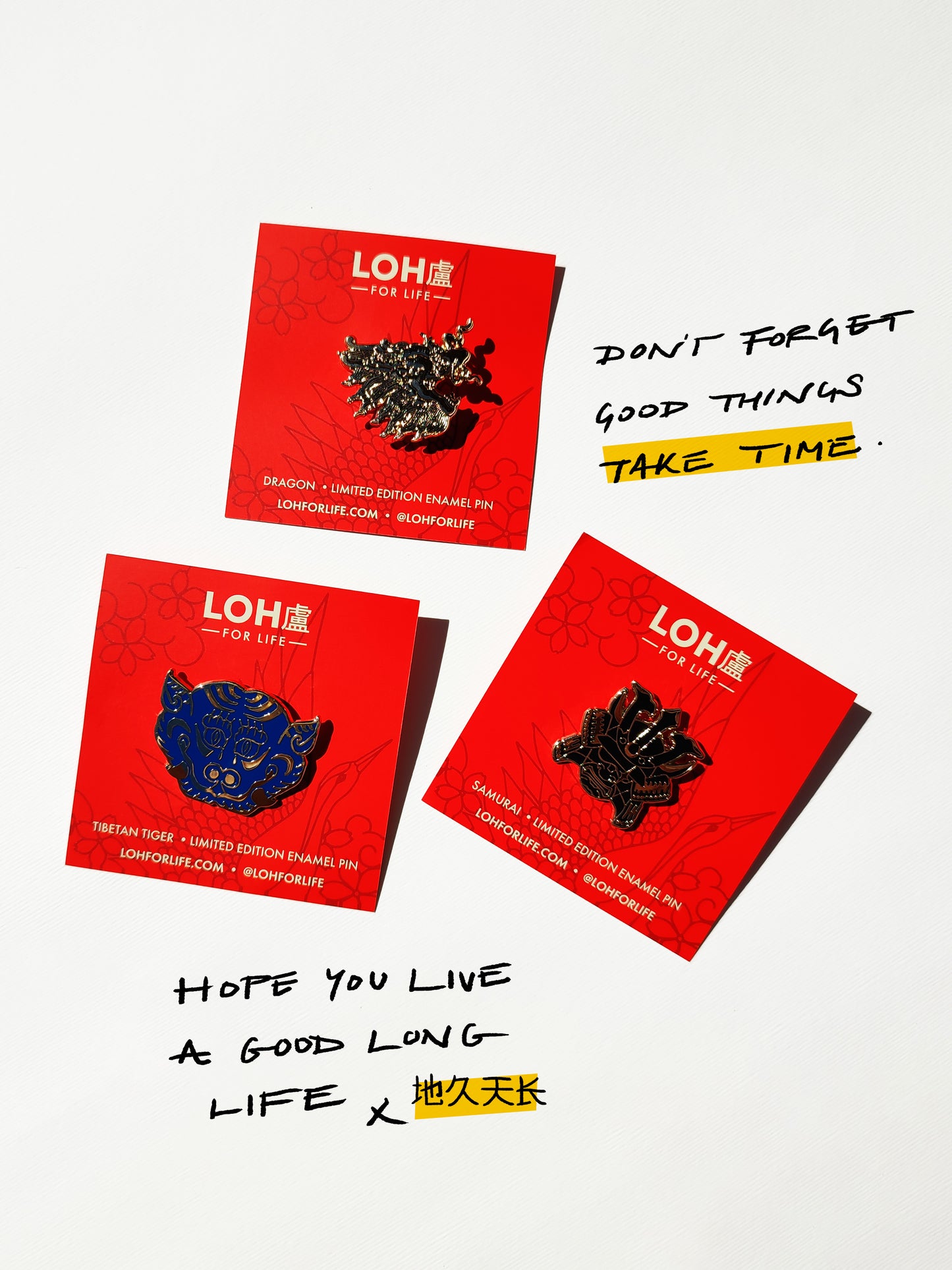 Three red LOH brand enamel pin display cards arranged on a white background with handwritten black text. The cards feature three different asian themed enamel pins in black, blue, and gold tones.